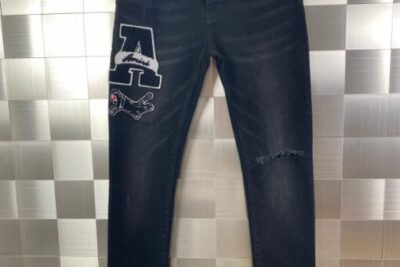 Amiri Varsity Patch Jeans Antique Black With Distressed Details