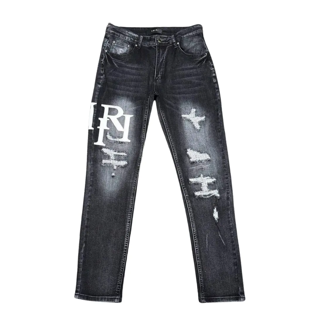 Deluxeside-2026-04-20T180013.215 Amiri Denim Jeans Ripped With White Logo Design - Image 1